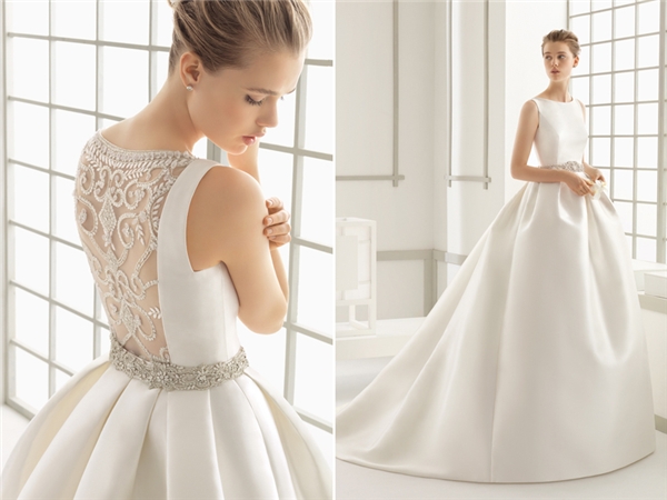 Chiếc váy cưới thuộc hãng Rosa Clara chứng minh rằng đẳng cấp không ở những viên đá đính kèm mà nằm ở sự tinh tế, đơn giản. Chất liệu vải sang trọng và những nếp gấp hoàn hảo khiến cho người mặc trở nên cực kì lộng lẫy. (Ảnh: Internet)