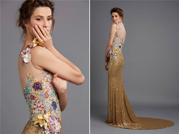 Khác với các hãng thiết kế khác, Hamda Al Fahim lựa chọn tông màu vàng ánh kim cho thiết kế của mình. Một rừng hoa bốn mùa được điểm xuyến quanh thân áo là điểm sáng nổi bật của chiếc váy cưới này. (Ảnh: Internet)