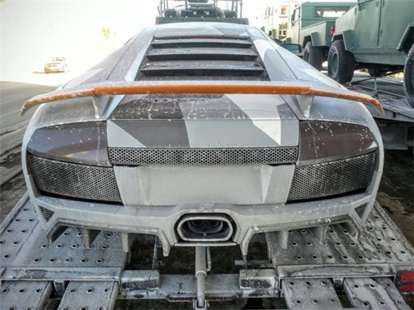  Image of a damaged Lamborghini during filming.